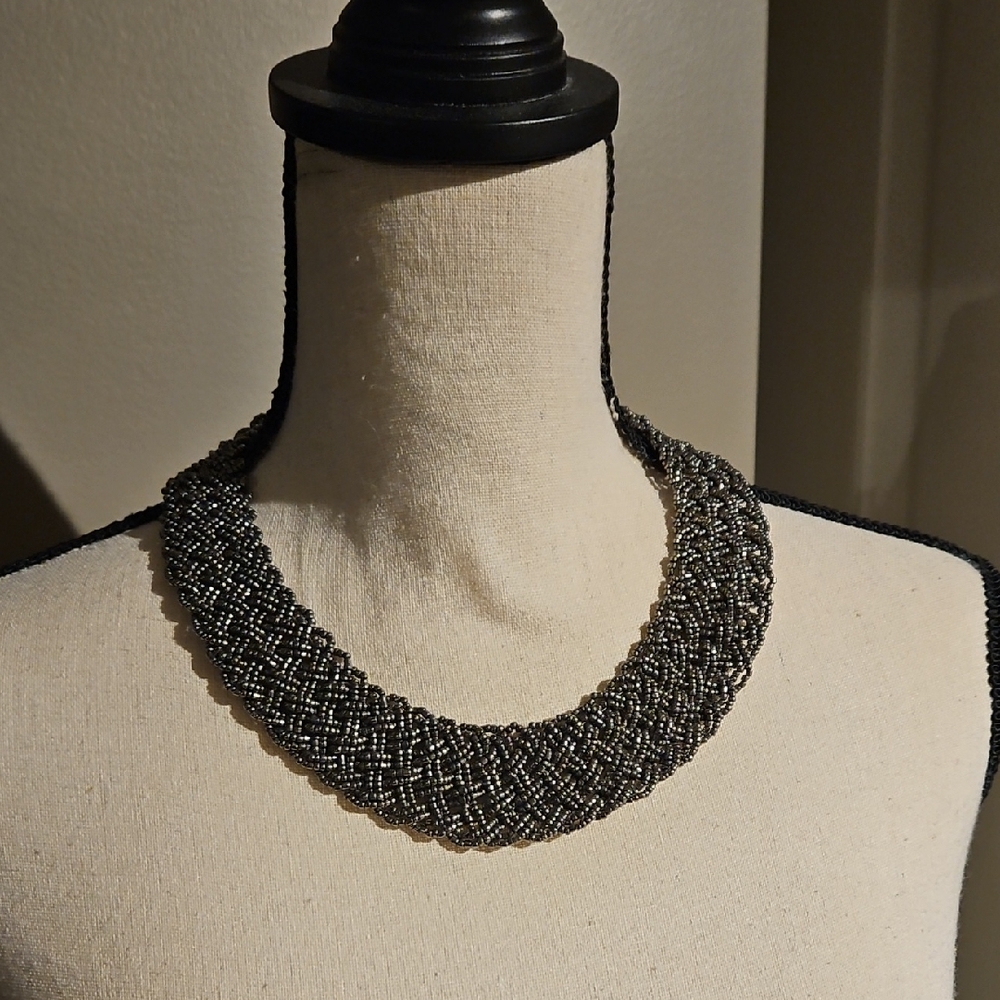 Stunning Vintage Platinum colored glass beaded necklace.